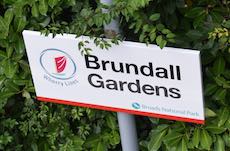 Brundall Gardens station sign